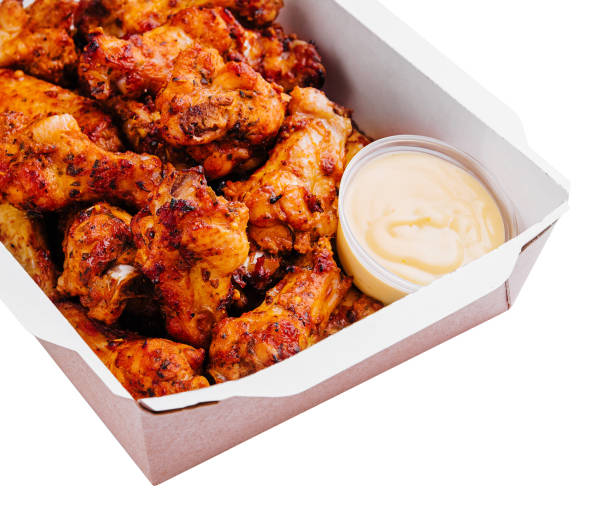 istock Fried chicken wings and legs in a paper box 2009669739