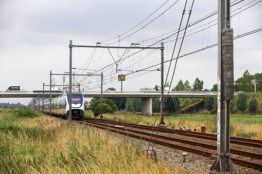 SLT local commuter train on railroad track at Moordrecht in the Netherlands