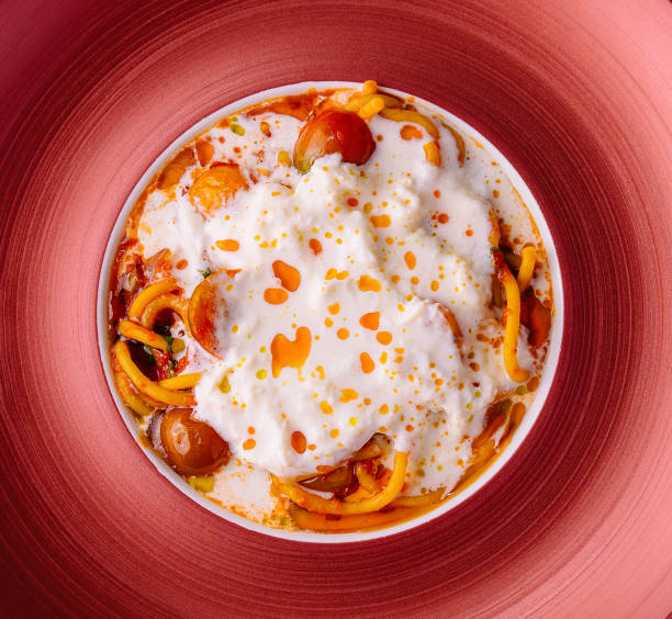 istock Italian spaghetti pasta with baked cherry tomatoes 2009687456