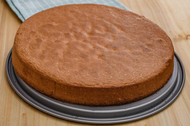 istock A baked round brown sponge cake lies on the table 2009688028