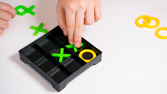 Board game of tic-tac-toe on a light background