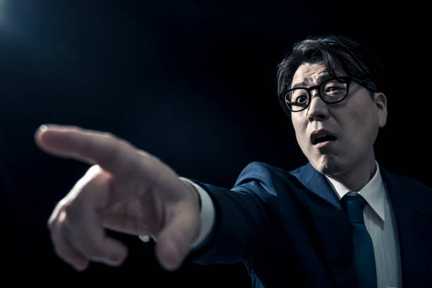 istock Middle-aged Businessman Pointing Authoritatively and Giving Instructions 2009691852