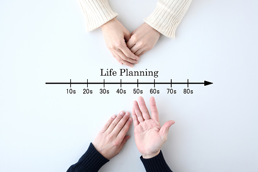 Couple's hands and life planning indication with age