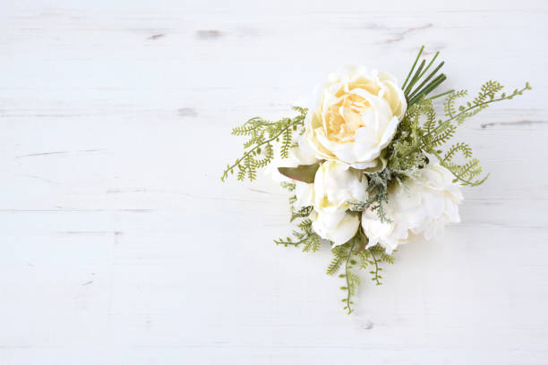Wedding bouquet placed on white wooden table