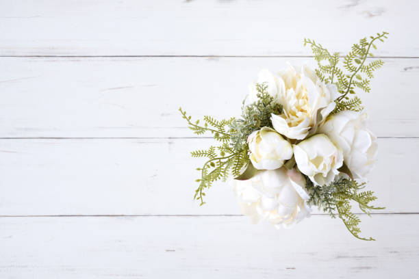 istock Wedding bouquet placed on white wooden table 2009692955