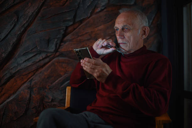 istock Senior man thought about what he read on his phone 2009714954