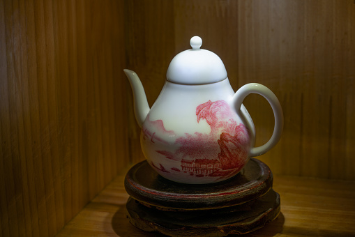 Porcelain tea and coffee cups on wood