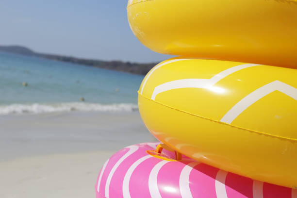 istock Inflatable rings on the beach. Summer concept 2009740944