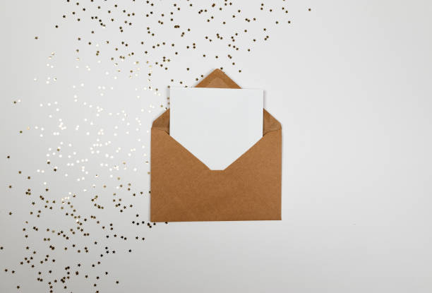 istock Christmas composition, kraft envelope, gold stars confetti on white background. 2009744692