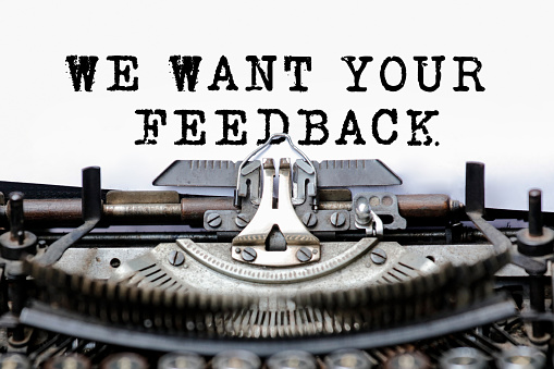 We want your feedback text on paper with typewriter