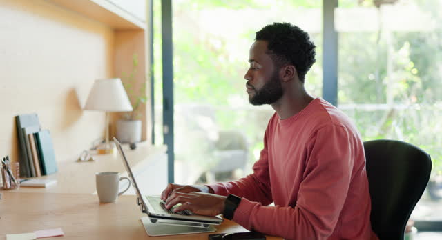 Man, laptop and typing in home office for online communication as freelance journalist for project, proposal or review. Black person, hands and keyboard for internet research, email or networking