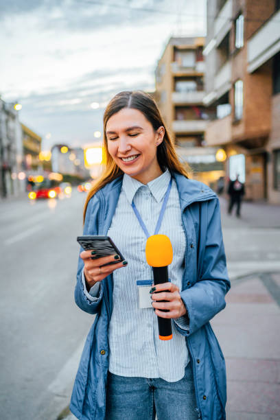 istock Female reporter in the city 2009760632
