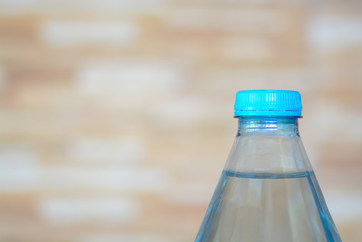 Water bottles on a bokeh background. The importance of staying hydrated, promoting both physical health and environmental consciousness