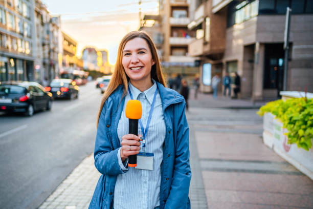 istock Female reporter in the city 2009766033