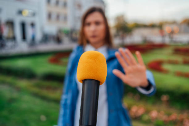 istock Woman refuses to speak for television 2009769174