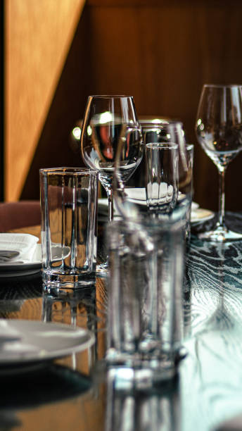 istock a wooden table with plates, glasses and silverware and wine glasses 2009809567