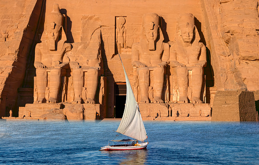Beautiful Nile scenery with sailboat in the Nile on the way to The Front of the Abu Simbel Temple - Egypt, Africa