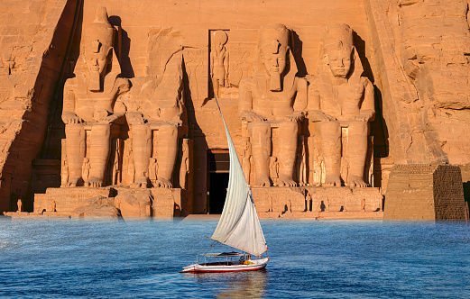 Kom Ombo double temple, Aswan governate, River Nile, Egypt. The temple is unique in being dedicated to two different deities, the local crocodile-headed god Sobek and the falcon-headed god Horus and is architecturally duplicated with two sets of courts, hypostyle halls and sanctuaries. The River Nile has always and continues to be a lifeline for Egypt. Trade, communication, agriculture, water and now tourism provide the essential ingredients of life - from the Upper Nile and its cataracts, along its fertile banks to the Lower Nile and Delta. In many ways life has not changed for centuries, with transport often relying on the camel on land and felucca on the river