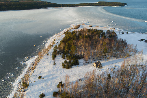 A lonely house on the island of Kresuli between the Viimsi peninsula and the island of Aegna. Photo from a drone in winter. High quality photo