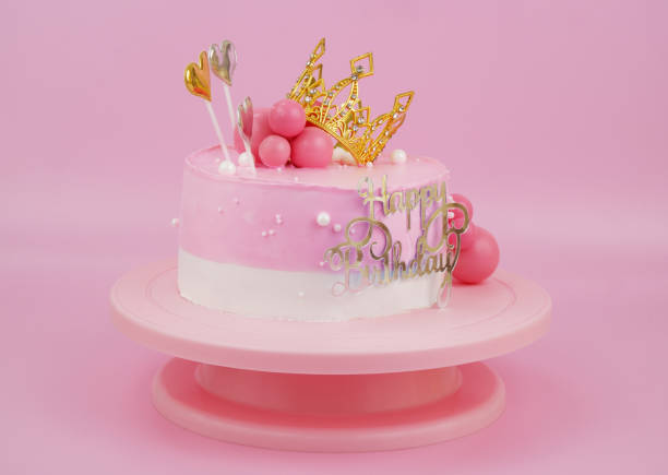 istock Pink birthday cake with gold crown and hearts 2009837813