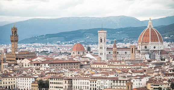 Picturesque view of beautiful Florence and the Apennines. The dome of the Cathedral of Santa Maria della Grazia and the Palazzo Vecchio tower