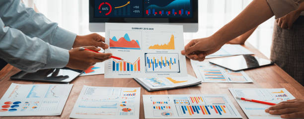 istock Analyst team utilizing BI Fintech to analyze financial dashboard. Scrutinize 2009851599
