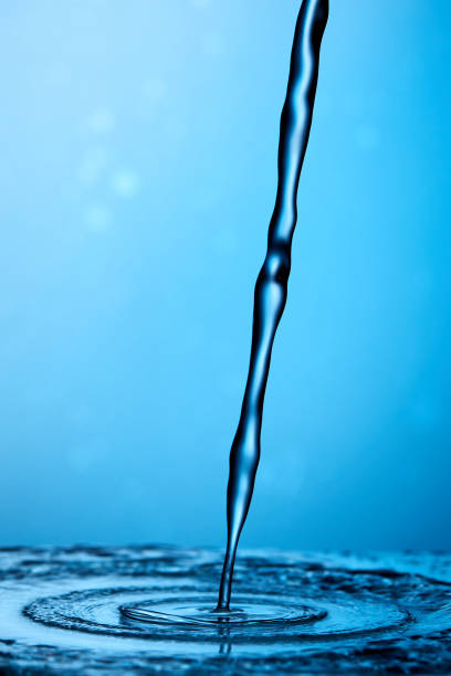 istock Splash Of Water Over Blue Background 2009852669