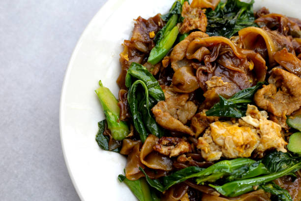 istock Stir-fried rice noodles with soy sauce and pork 2009856411
