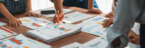 istock Analyst team utilizing BI Fintech to analyze financial dashboard. Scrutinize 2009858032
