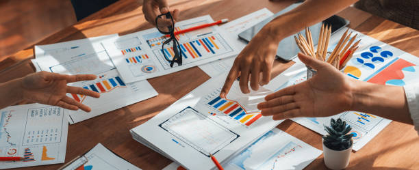 istock Analyst team utilizing BI Fintech to analyze financial dashboard. Scrutinize 2009863405