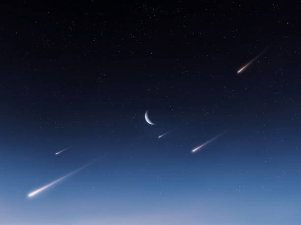 istock Starfall in the night sky with the moon. 2009870471