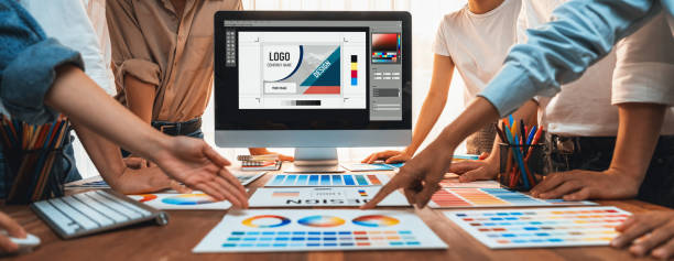 istock Graphic designer brainstorming logo and graphic arts at workshop. Scrutinize 2009880750