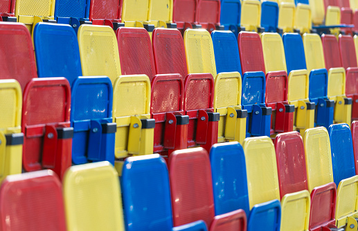 Germany, Berlin, January 27, 2024 - Full frame of colorful stadium seats, Berlin Zehlendorf