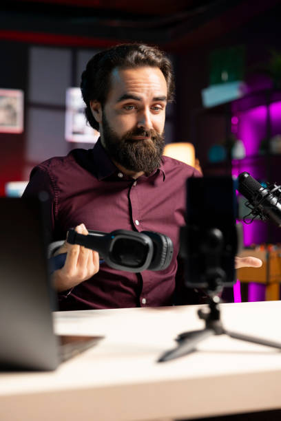 istock Tech guru promoting music listening device, doing influencer marketing 2009885755