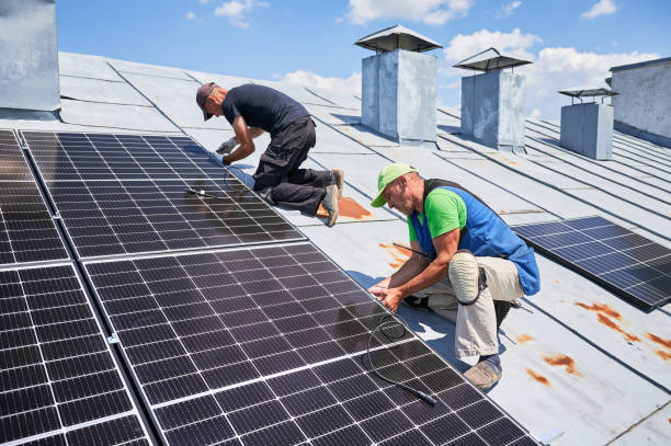 istock Workers building solar panel system on roof of house. Men installing photovoltaic solar module 2009889118