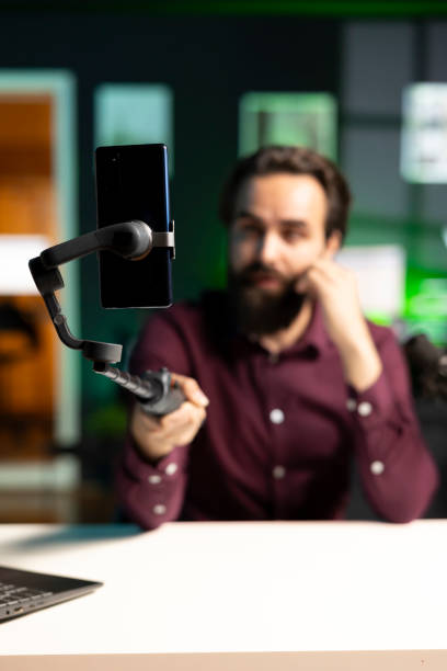 istock Close up on professional microphone used by man doing relaxing ambient sounds 2009890283