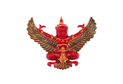 red Garuda statue with wings isolated on white background