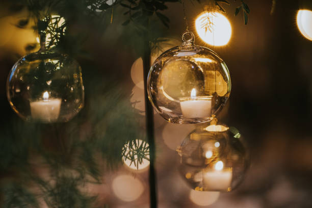 istock Hanging glass balls with lit candles inside. 2009918428