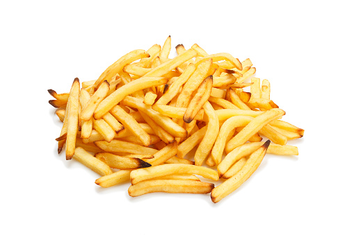 Heap of fried potatoes isolated on white background. A pile of fries against a white background.
