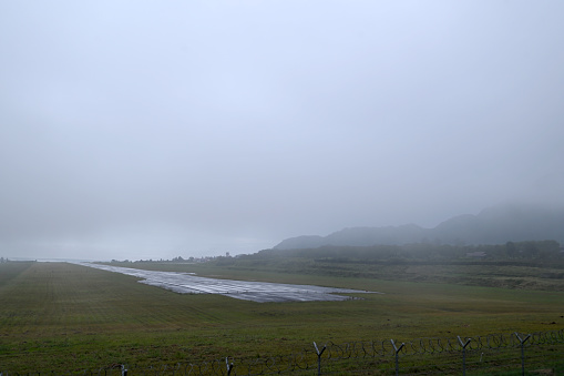 Photo taken from a public road shows the airport runway in Bener Meriah, Tekengon, Aceh province shrouded in fog