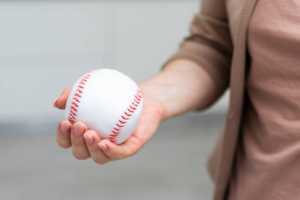 istock Small toy baseball isolated on white background 2009999050