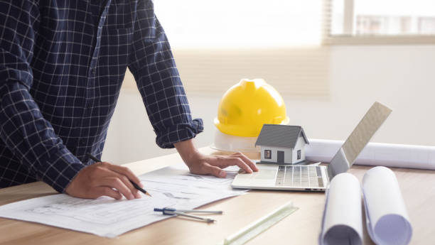 istock Construction concept Home architect reviewing house plans and customized design before delivery Interior design and decoration ideas 2010004538