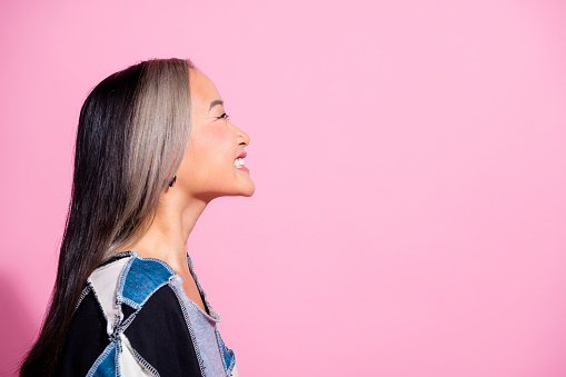 Profile photo of cheerful excited person beaming smile look empty space ad isolated on pink color background.