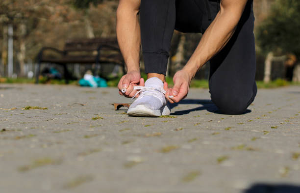 istock Unrecognizable Caucasian man tying his sneakers 2010028915