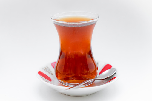 Glass of Turkish tea on wooden table