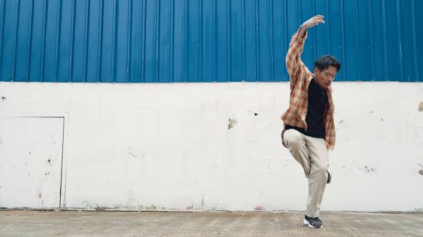 istock Hispanic funny choreographer dancing in hip hop style. Modern dance. Endeavor. 2010050252