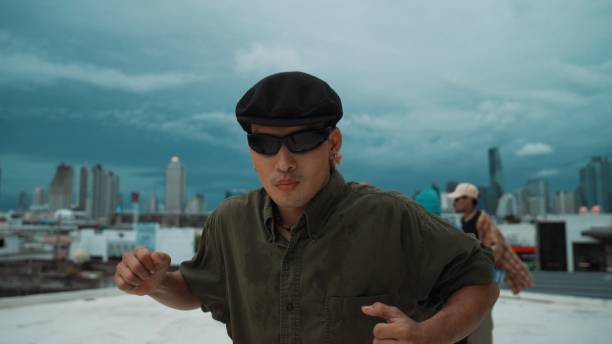 istock Closeup image of profession hipster dancing break dance at rooftop. Endeavor. 2010059350