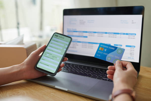 istock Woman Paying Utility Bills Online 2010072548