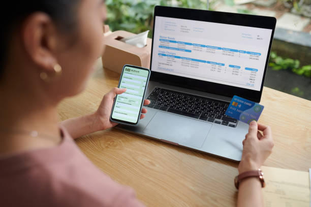 istock Woman Paying for Utility Bills Online 2010073069