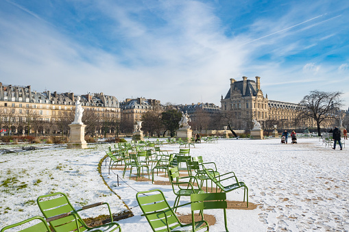 Paris, France, 18th of January 2024, Snowy Tuileries gardens with classical statue in the winter time,